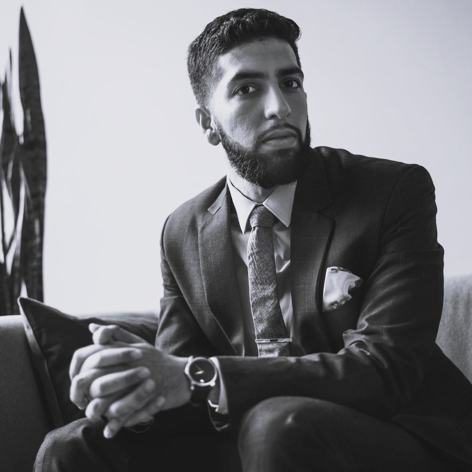 a man sitting in a suit